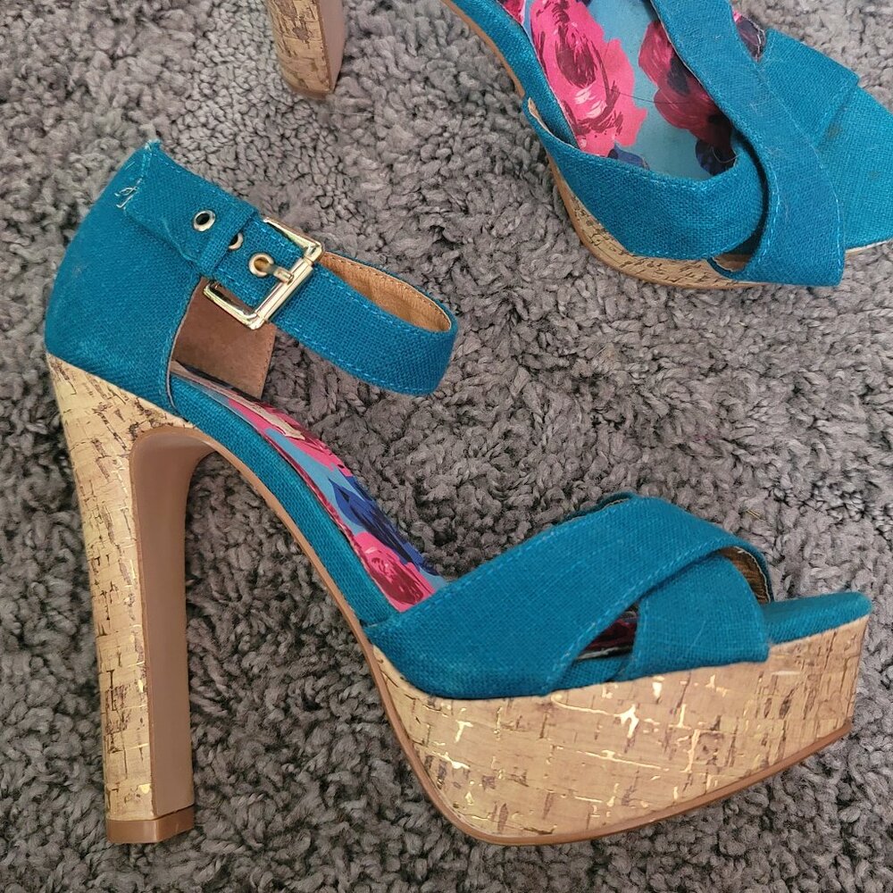 Blue platform heels with gold accents